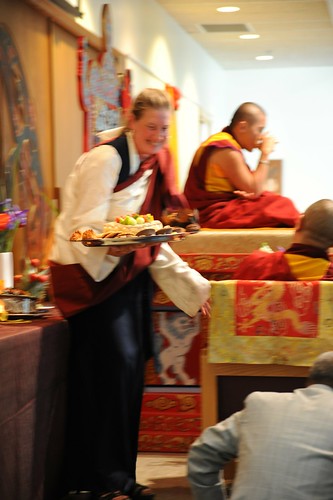 Still Tsok, while the room vibrates around it, sangha member in an adi prepares tsok offering, Spontaneously Occurring Heart Essence of Padma, Rangjung Padma'i Nyingthig, given by Khyentse Yangsi Rinpoche, Lotus Speech, Vancouver BC, Canada by Wonderlane