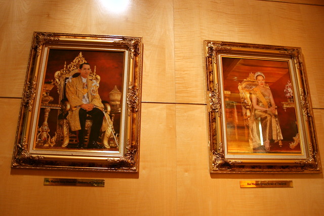 It's a Thai hotel! The portraits of the King and Queen oversee the concierge