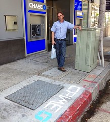 Alexander Schaefer was arrested in LA for chalking the sidewalk with anti-bank messages.