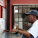 Customer picking up an order at Peking House, Dudley Square, Roxbury posted by Planet Takeout to Flickr