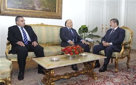 Muslim Brotherhood's President-elect Mohamed Mursi (R) meets with Saad al-Katatni, speaker of the Egyptian parliament and senior member of the Muslim Brotherhood (C) and Ahmed Fahmy, speaker of the Shura Council (the upper, consultative house of Egypt. by Pan-African News Wire File Photos