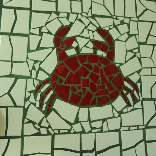 Red crab mosaic, white tile background, concrete, Sam's Crab Shack, women's bathroom art, Schaumburg, Illinois, USA by Wonderlane