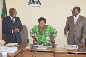 President Mugabe and Vice President Joice Mujuru share a lighter moment with Zanu-PF secretary for administration Cde Didymus Mutasa, who turned 77 July 27, 2012 before the extra-ordinary session of the Politburo. by Pan-African News Wire File Photos