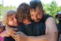 Arrested Occupier is greeted by his friends after release from mass arrest on Wildcat March during NATGAT July 1