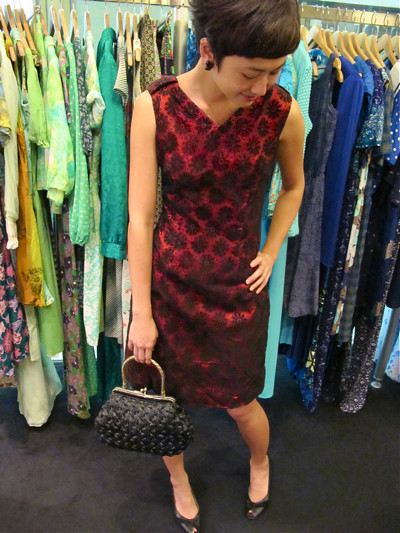 Gorgeous 1960s lace daisy dress in a deep shade of burgundy! Size M/L. Matched with a 1960s black straw bag.