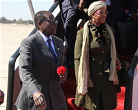 Republic of Zimbabwe President Robert Mugabe with First Lady Grace Amai at Harare International Airport after attending the Rio+20 Summit in Brazil. The UN summit addressed sustainable development. by Pan-African News Wire File Photos