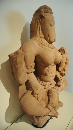 Hayagriva Yogini, seated, holding a child, statue from India Uttar Pradesh, or Madhya Pradesh, 11th century, beige sandstone, Art Institute of Chicago, Illinois, USA by Wonderlane