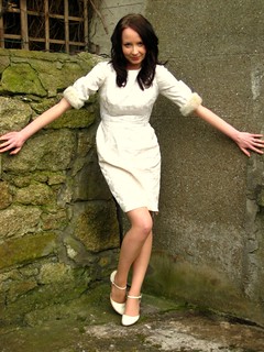 a woman in a vintage white dress