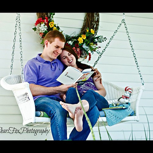 Reading to the babe. #pregnancy #maternity #nate #michelle #swing #porchswing #books #drsuess