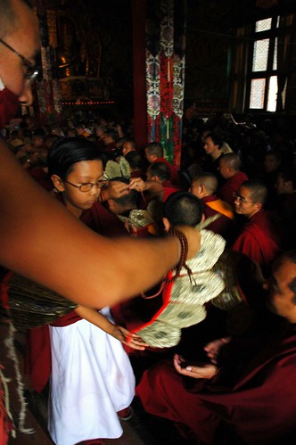 Chopan assisting the young lama prince HE Asanga Sakya, blessing and distributing 5 Dhyani Buddhas crown, to a Tibetan monk for initiation, Lam Dre, Tharlam Monastery, Boudha, Kathmandu, Nepal by Wonderlane
