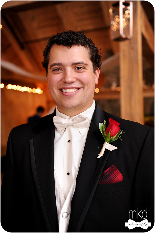 Groom in tux with white bowtie