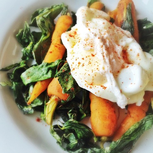 Braised carrots with cumin, broad bean tops and poached egg. #dinner