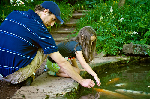 Petting the fish at the grotto.