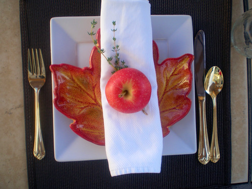 fall pacesetting white square plates layered with leaf plates, apples and napkins