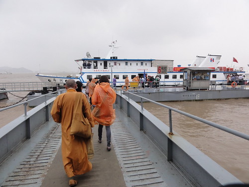 Walking to the boat with a monk ahead of me