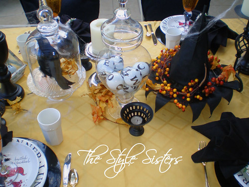 Witchy Woman Tablescapes in gold black and white. Crow under glass