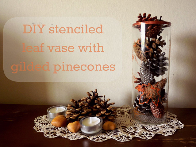 Stenciled leaf vase with gilded pinecones
