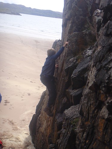 Bouldering on the rocks at Gaineamh Mhor beach, Gairloch