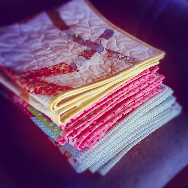 Wahoooo 10 baby quilts are bound & ready for washing