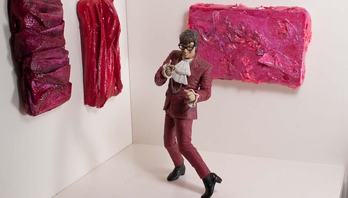 Austin Powers action figure with miniature paintings by Tiffany Gholar