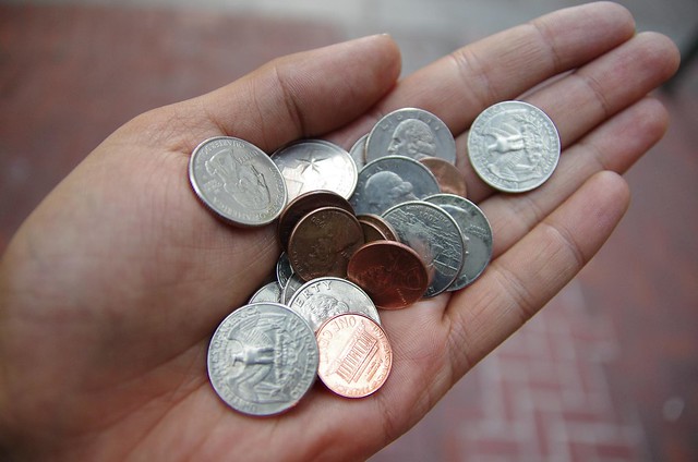 Holding American Coins in hand
