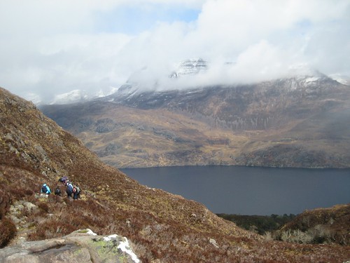 Heading back down in the sun with a snowy Slioch in the clouds behind, Beinn Eighe Nature Trail