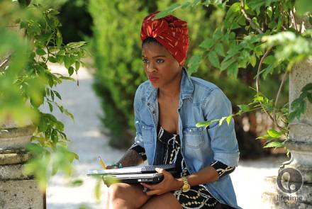 Sonjia sketching under a tree