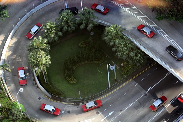 Red Toyota Crown Taxis Dominate Hong Kong Roads - Aerial view
