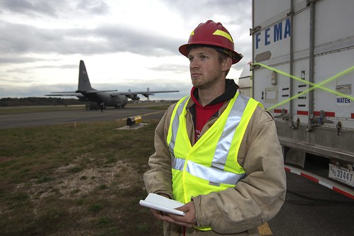U.S. Forest Service employee Jordon Sanders from Harlan, IA., waits for military aircraft to drop off more supplies in response to Hurricane Sandy at the Republic Airport in Farmingdale, NY, on Thursday, Nov 1, 2012. USDA photo by Dave Kosling.