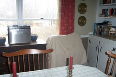 Under the covering is my sewing machine and our ice cream maker... not exactly things you want in your dining room.