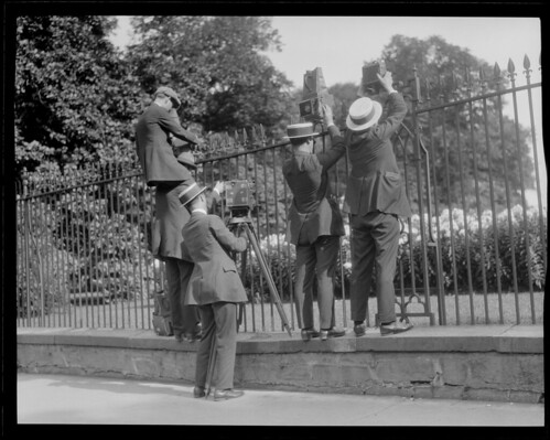 Photographers take pictures over fence when young Coolidge died of blood poisoning
