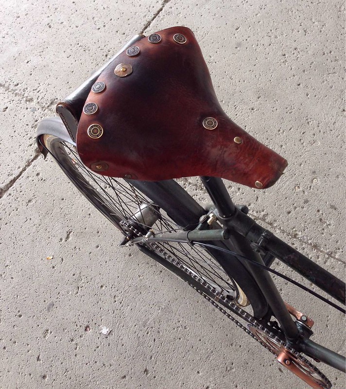 Well-used, copper-rivet, leather saddle