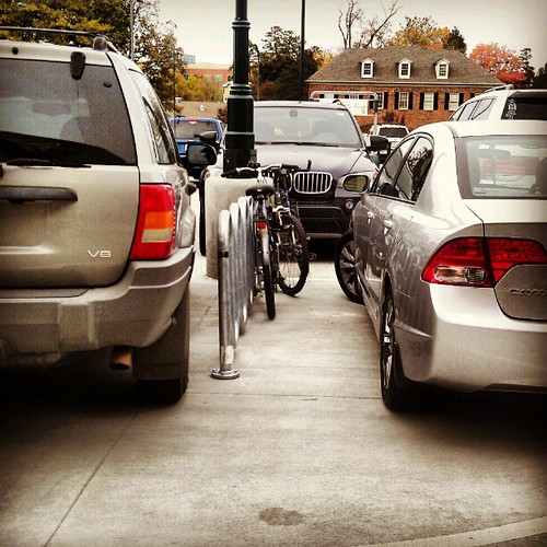 Nothing says Charlotte like having to squeeze your bikes between two cars in the bike spot.
