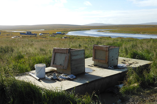 Common waste collection sites on the Alaskan tundra.  USDA, with its partners, is working to retire systems like this and replace them with safe, sanitary water and sewer systems.