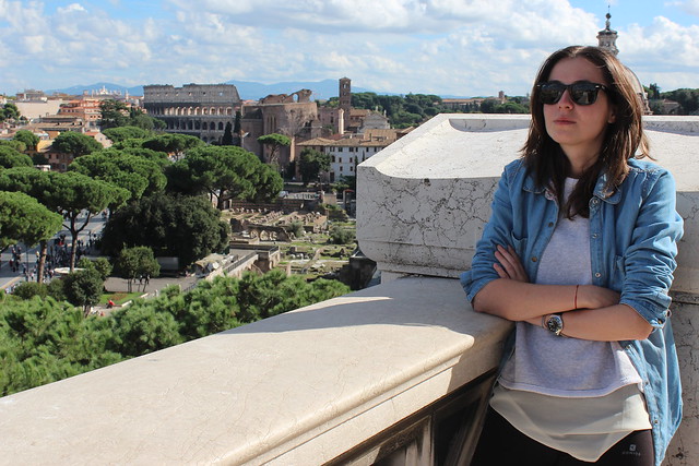 on top of Vittorio Emanuele II Monument with the Colosseum in the background, Rome