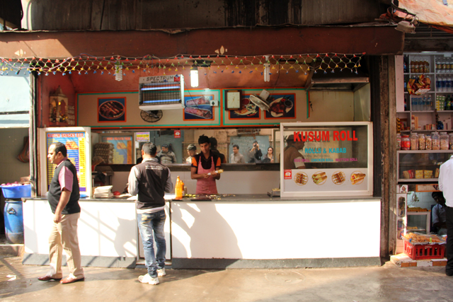 Standing and dining area at Kusum Rolls in Kolkata, India