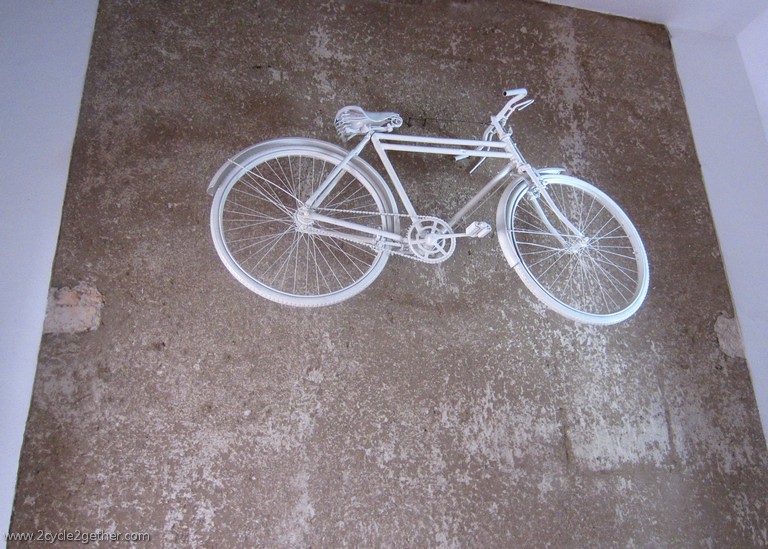 Casa Ciclista, White Bicycle Wall in Shop