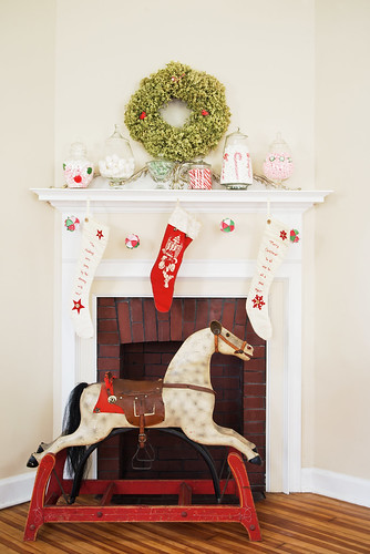 Christmas fireplace display with antique pony.