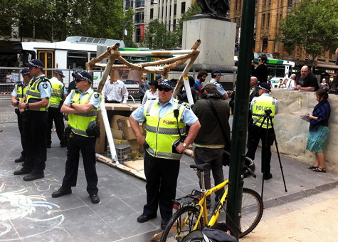 VicPol heroically protecting the public from bylaw-violating cardboard structure menace