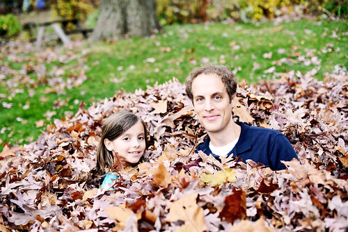 Hanging in the leaves with daddy.