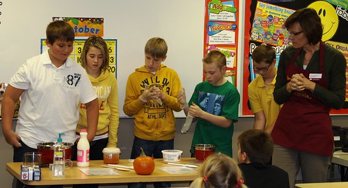 Bonnie Chirstenson from University of Minnesota Extension (far right) shows students in Mrs. Jones’ sixth-grade class in Tracy Elementary how to make pumpkin pudding using a locally grown pumpkin.