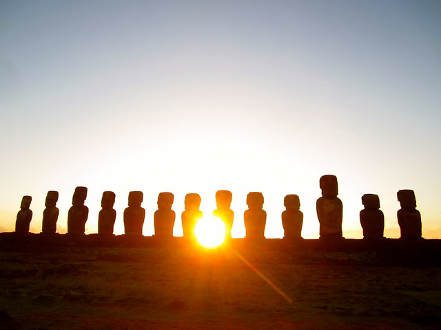 sunrise over moai in easter island