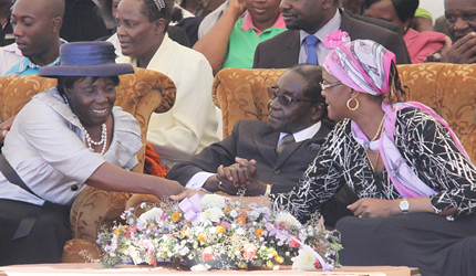 Republic of Zimbabwe President Robert Mugabe with First Lady Amai Grace at funeral of her aunt inside the country. Mugabe calls for the respect of the nation's sovereignty. by Pan-African News Wire File Photos