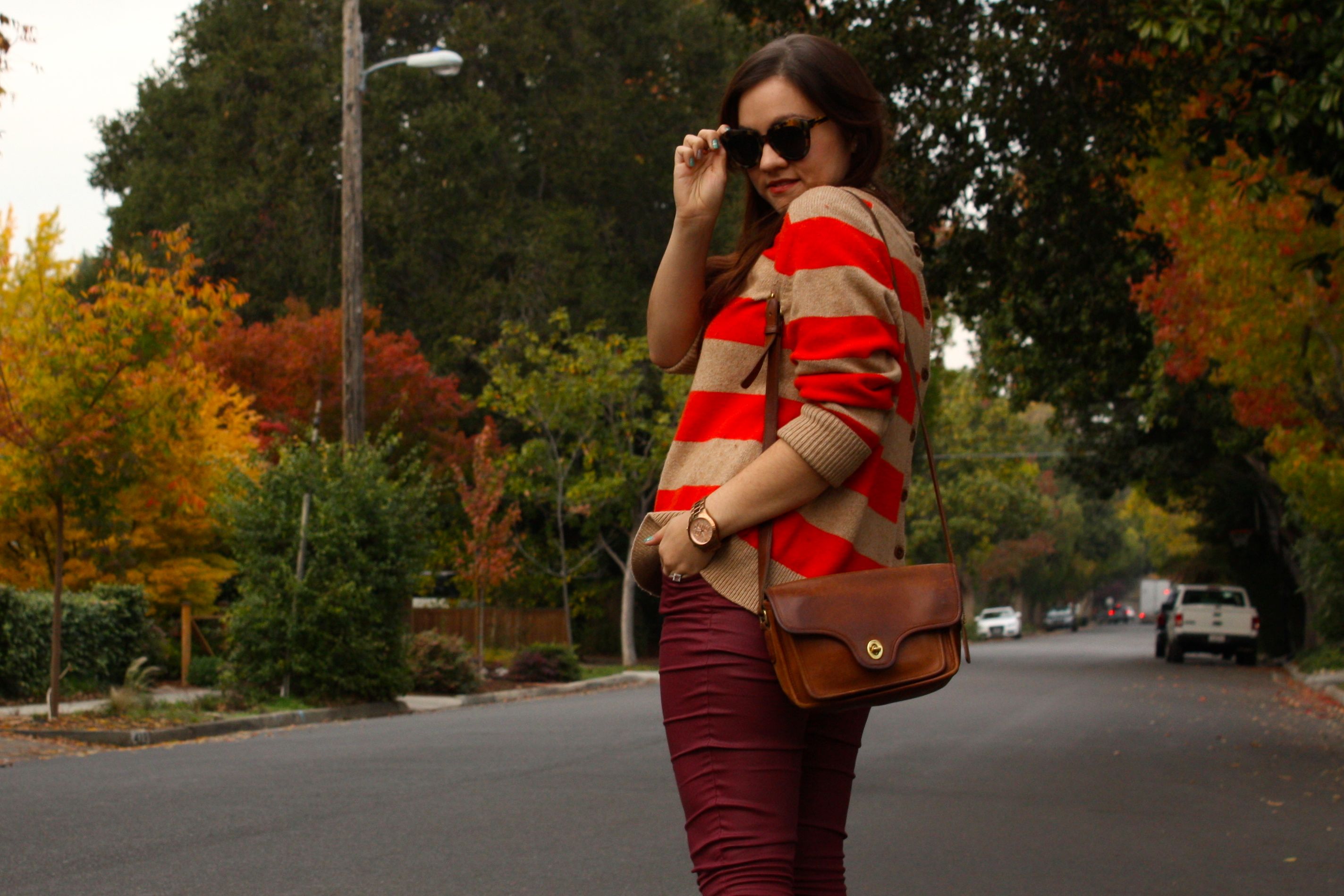 burgundy waxed jeans with orange striped lands end sweater and brown coach bag plus glitter booties02