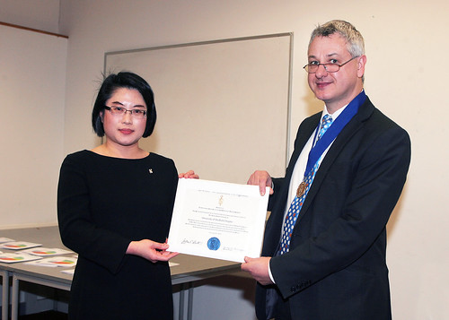 Dr Gary Simpson of Aston Business School presents Professor Lenny Koh with the Sheffield BGS Chapter Charter