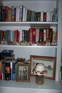 Some books live in the dining room in the shelves Paul built to use for china... oh well... Note photo of Paul getting his Eagle Scout Award...my hero!