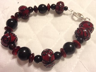 Red Lampwork beads with horn & Onyx