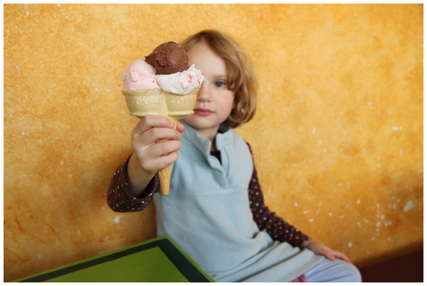 A little girl and her giant ice cream cone