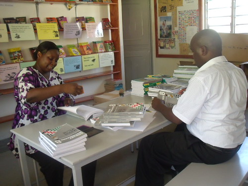 Mr Pius & Madam Sharon distribute the books.JPG
