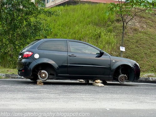only in malaysia, all four wheels stolen, somewhere in seri kembangan 282384_10150258091463276_2176175_n